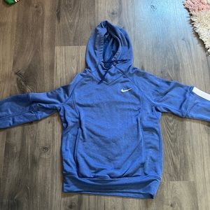 Blue Nike hooded sweatshirt.